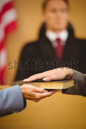 Witness swearing on the bible telling the truth Stock photo © wavebreak_media