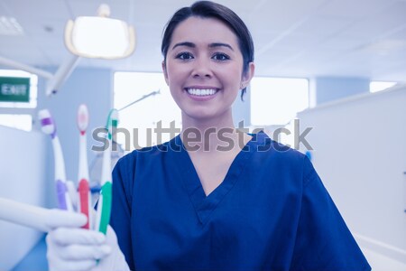 Jovem feminino biólogo sorridente câmera hospital Foto stock © wavebreak_media