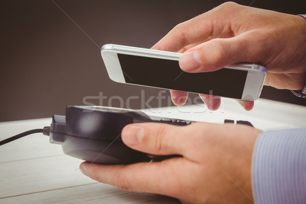 Man using smartphone to express pay  Stock photo © wavebreak_media
