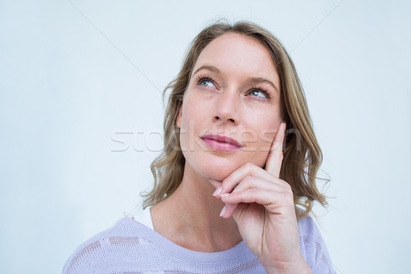 Stock photo: Thoughtful pretty woman