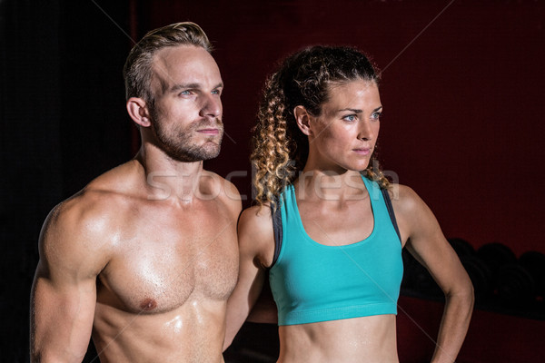 Attentive muscular couple looking away Stock photo © wavebreak_media