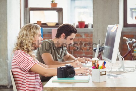 Cheerful designers working on a document Stock photo © wavebreak_media