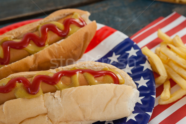 Hot dog served on plate with french fries Stock photo © wavebreak_media