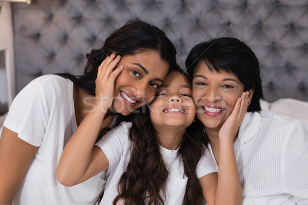 Portrait of smiling multi-generation embracing on bed Stock photo © wavebreak_media