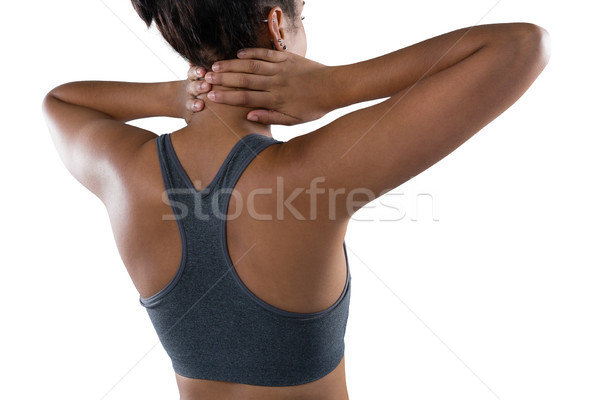Női atléta üzenetküldés nyak hátsó nézet fehér Stock fotó © wavebreak_media