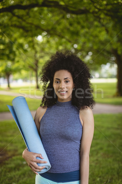 Woman holding exercise mat in the park Stock photo © wavebreak_media