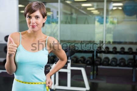 Athletic woman smiling to camera Stock photo © wavebreak_media