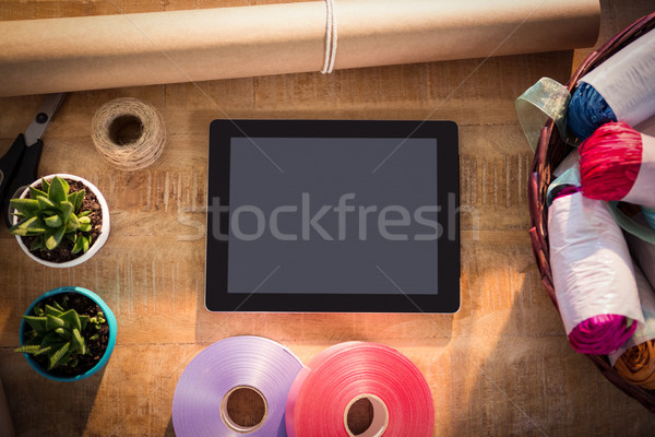 Digital tablet and florist supplies on the wooden table Stock photo © wavebreak_media