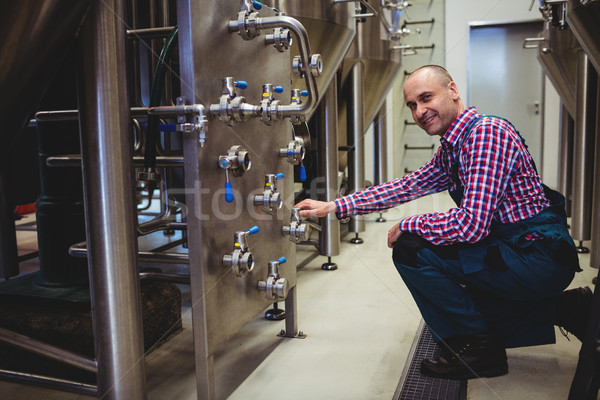 Brewery manufacturer adjusting pressure gauge Stock photo © wavebreak_media