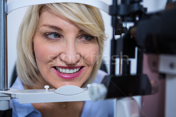 Female patient under going eye test on slit lamp Stock photo © wavebreak_media