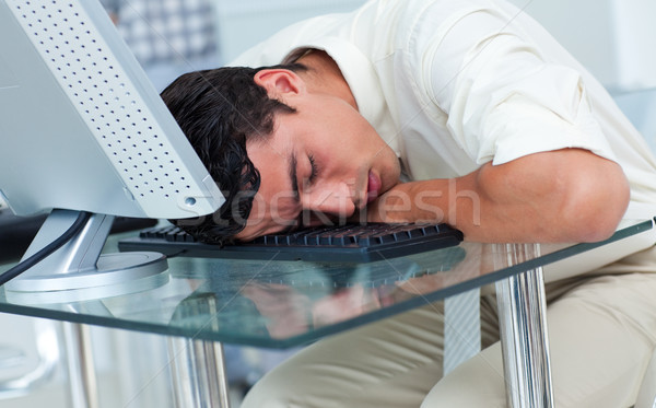 Tired businessman sleeping at his desk Stock photo © wavebreak_media