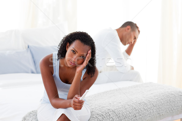 Disconcerted couple finding out results of a pregnancy test  Stock photo © wavebreak_media