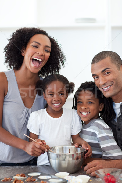 Jolly family making cookies together Stock photo © wavebreak_media