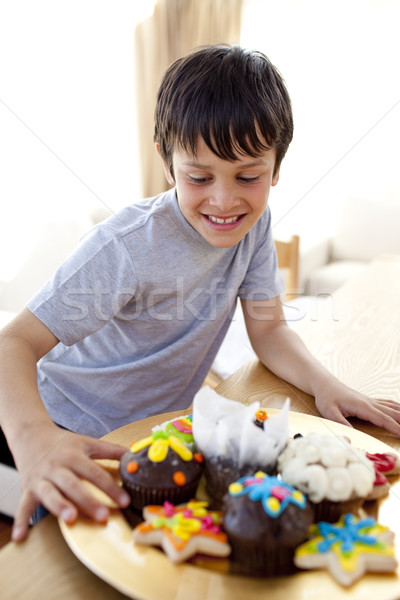 Happy boy looking at confectionery Stock photo © wavebreak_media