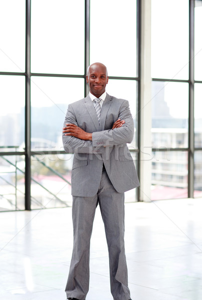 Smiling businessman with folded arms  Stock photo © wavebreak_media