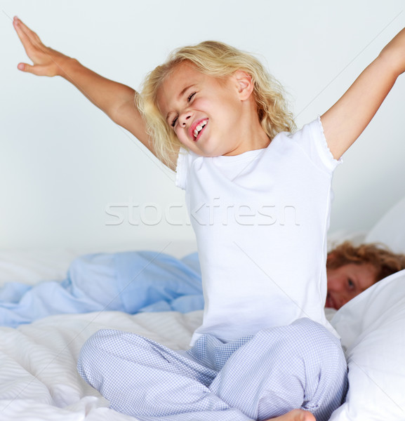 Smiling little girl looking at the camera Stock photo © wavebreak_media