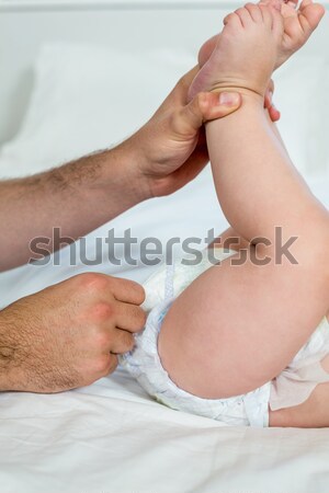 Stock photo: A doctor checking the pulse of a patient