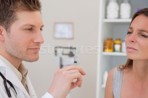 Doctor with syringe for patient Stock photo © wavebreak_media