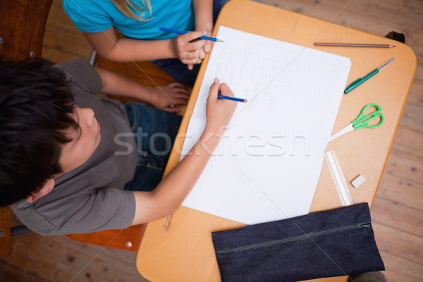Above view of pupils working together in a classroom Stock photo © wavebreak_media