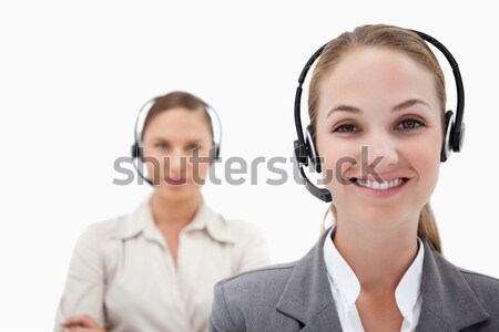 Smiling operators with headsets against a white background Stock photo © wavebreak_media