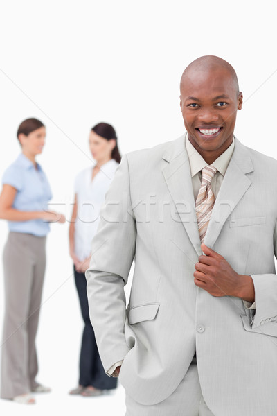 Smiling tradesman with associates behind him against a white background Stock photo © wavebreak_media