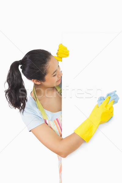 Laughing woman who washes the white plate from the side  Stock photo © wavebreak_media