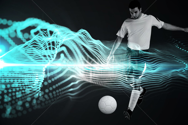 Composite image of football player in white kicking Stock photo © wavebreak_media