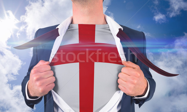 Stock photo: Businessman opening shirt to reveal england flag