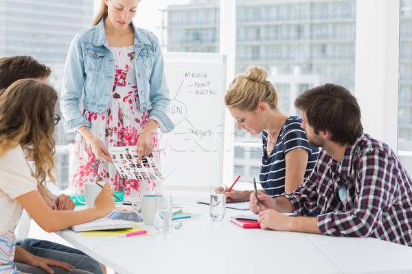 Casual business people in office at presentation Stock photo © wavebreak_media