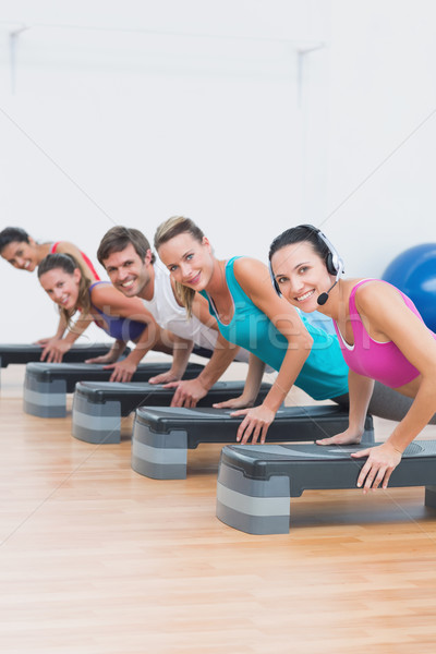 Fitness class doing step aerobics exercise Stock photo © wavebreak_media