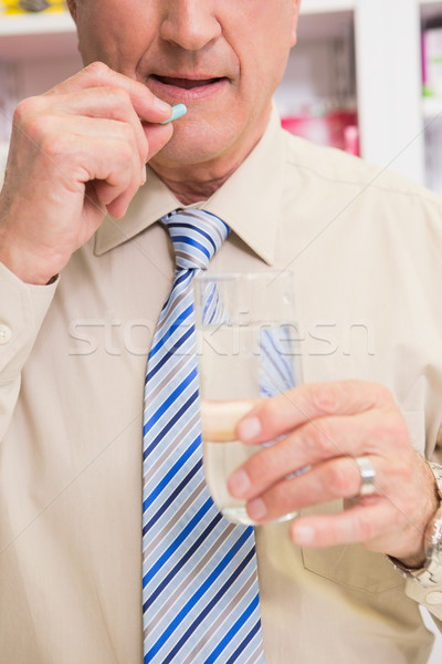 Senior patient taking a pill  Stock photo © wavebreak_media
