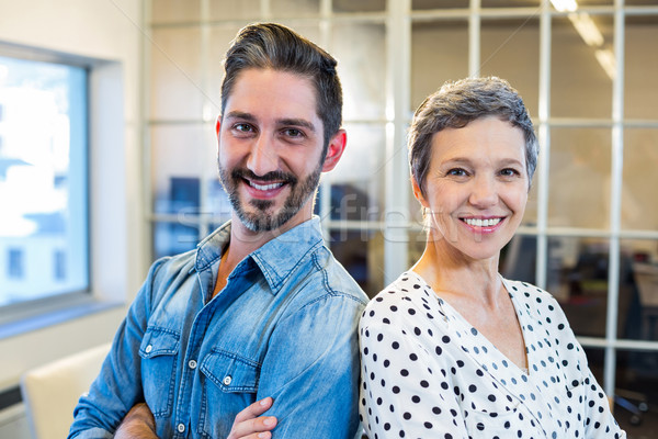 Stock photo: Smiling team standing arms crossed