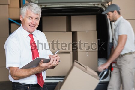 Warehouse worker using digital tablet Stock photo © wavebreak_media
