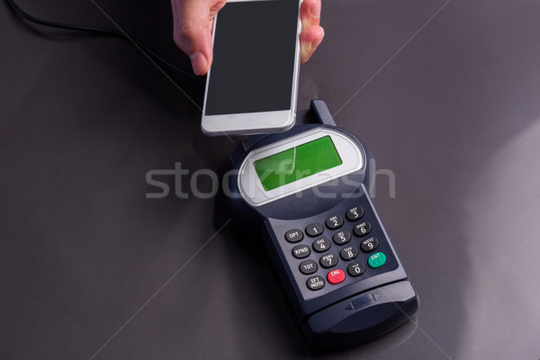 Man using smartphone to express pay  Stock photo © wavebreak_media