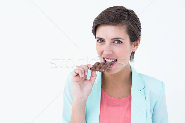Csinos nő eszik bár csokoládé fehér női Stock fotó © wavebreak_media