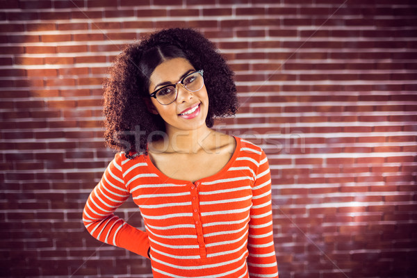 Aantrekkelijk jonge vrouw glimlachend portret Rood baksteen Stockfoto © wavebreak_media