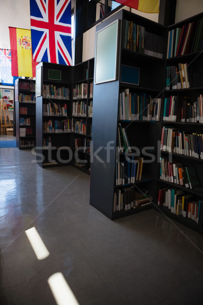 Flags by bookshelf in library Stock photo © wavebreak_media
