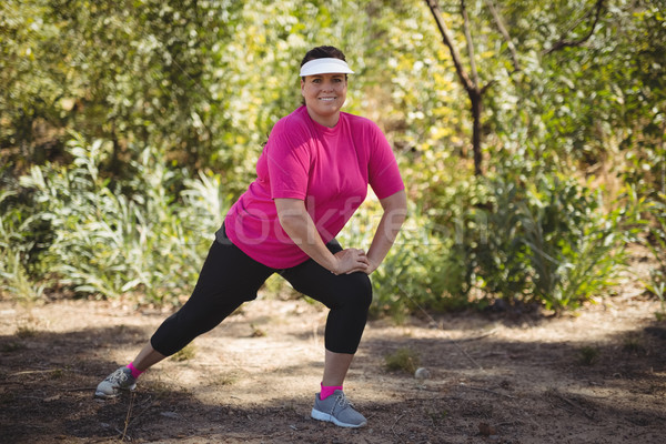 Portrait of happy woman exercising during obstacle course Stock photo © wavebreak_media
