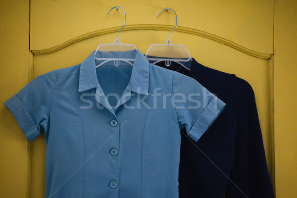 School uniform and bag hanging on door Stock photo © wavebreak_media