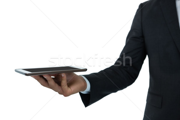 Cropped image of businessman holding digital tablet Stock photo © wavebreak_media