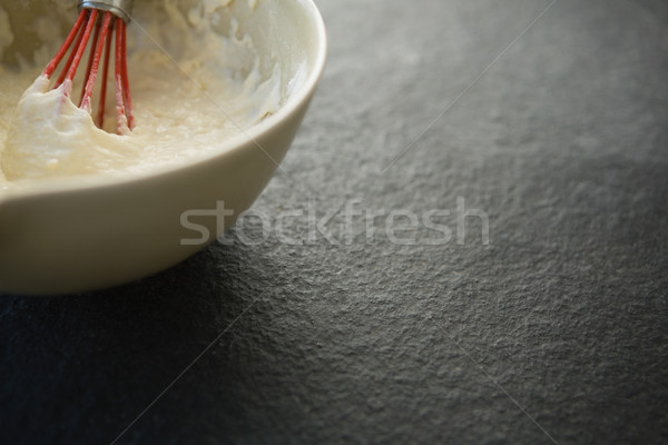 Overhead view of batter with wire whisk in bowl Stock photo © wavebreak_media