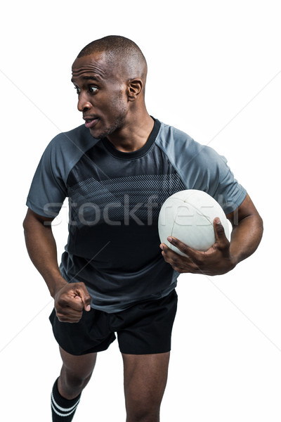 Sportsman running with clenched fist while holding rugby ball Stock photo © wavebreak_media