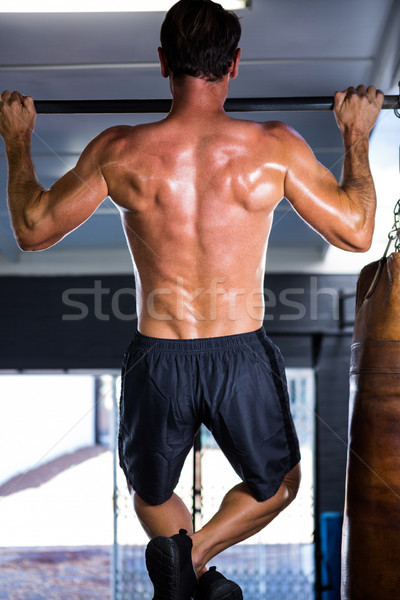 Rear view of athlete doing chin-ups  Stock photo © wavebreak_media