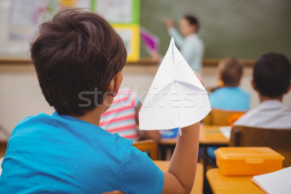 Pupil about to throw paper airplane Stock photo © wavebreak_media