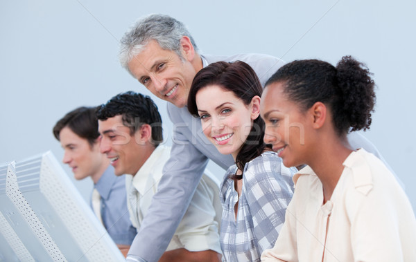 Confident manager checking his team in a company Stock photo © wavebreak_media