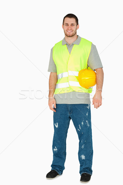 Mosolyog fiatal építőmunkás hordoz sisak kar Stock fotó © wavebreak_media