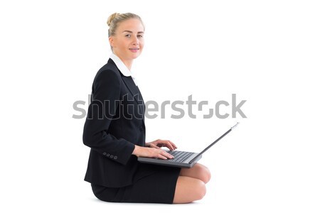 Businesswoman smiling with a coffee and newspaper against white background Stock photo © wavebreak_media