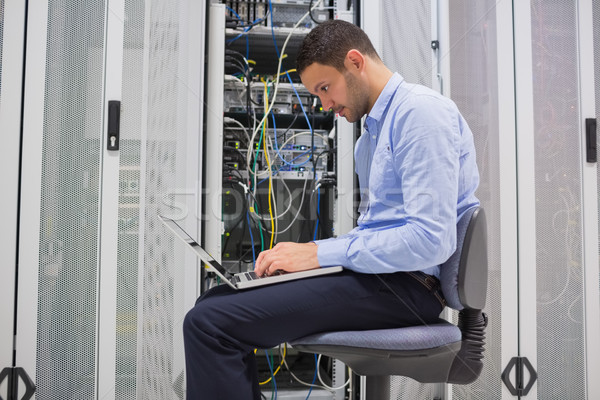 Man trying to find a solution for servers in data center Stock photo © wavebreak_media