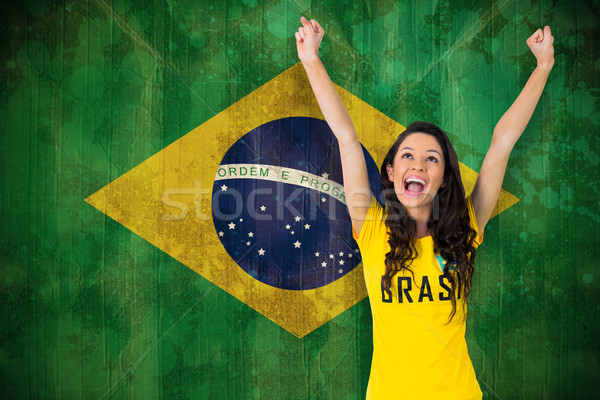 Excited football fan in brasil tshirt Stock photo © wavebreak_media