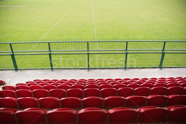Red bleachers looking down on football pitch Stock photo © wavebreak_media